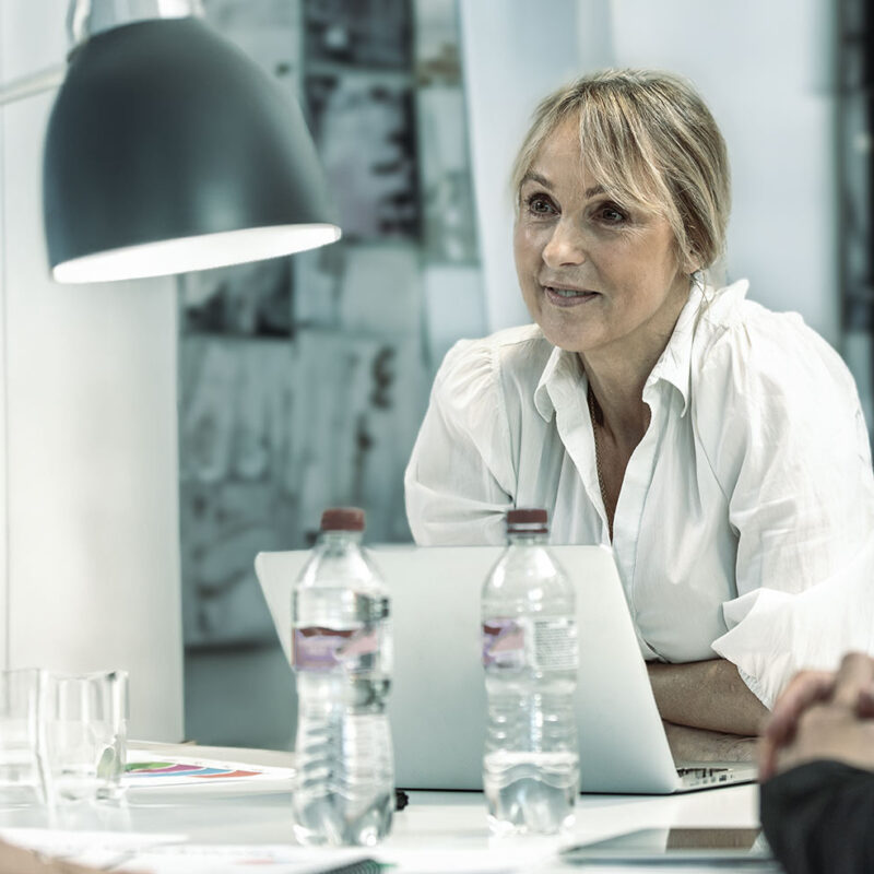 Leadership and culture: Female manager at a meeting