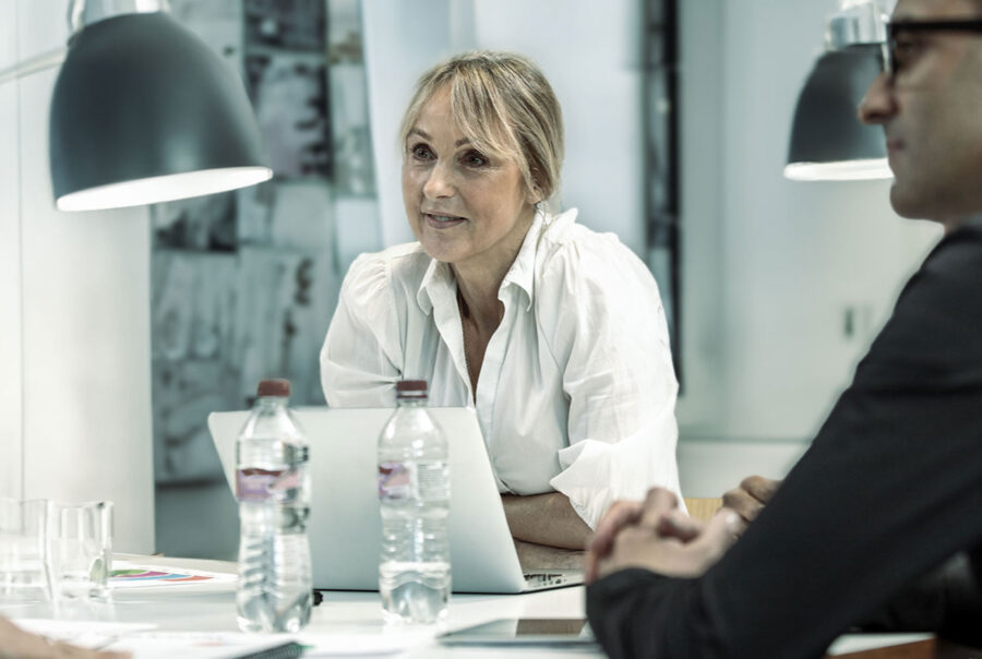 Leadership and culture: Female manager at a meeting