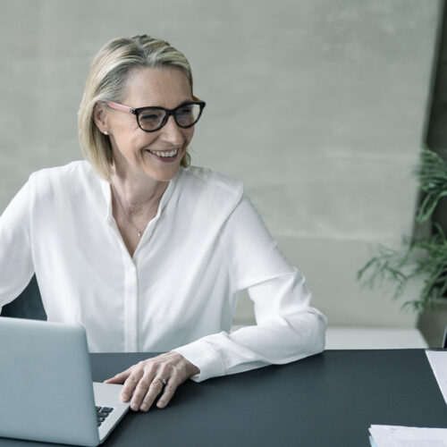 Professional smiling in a meeting