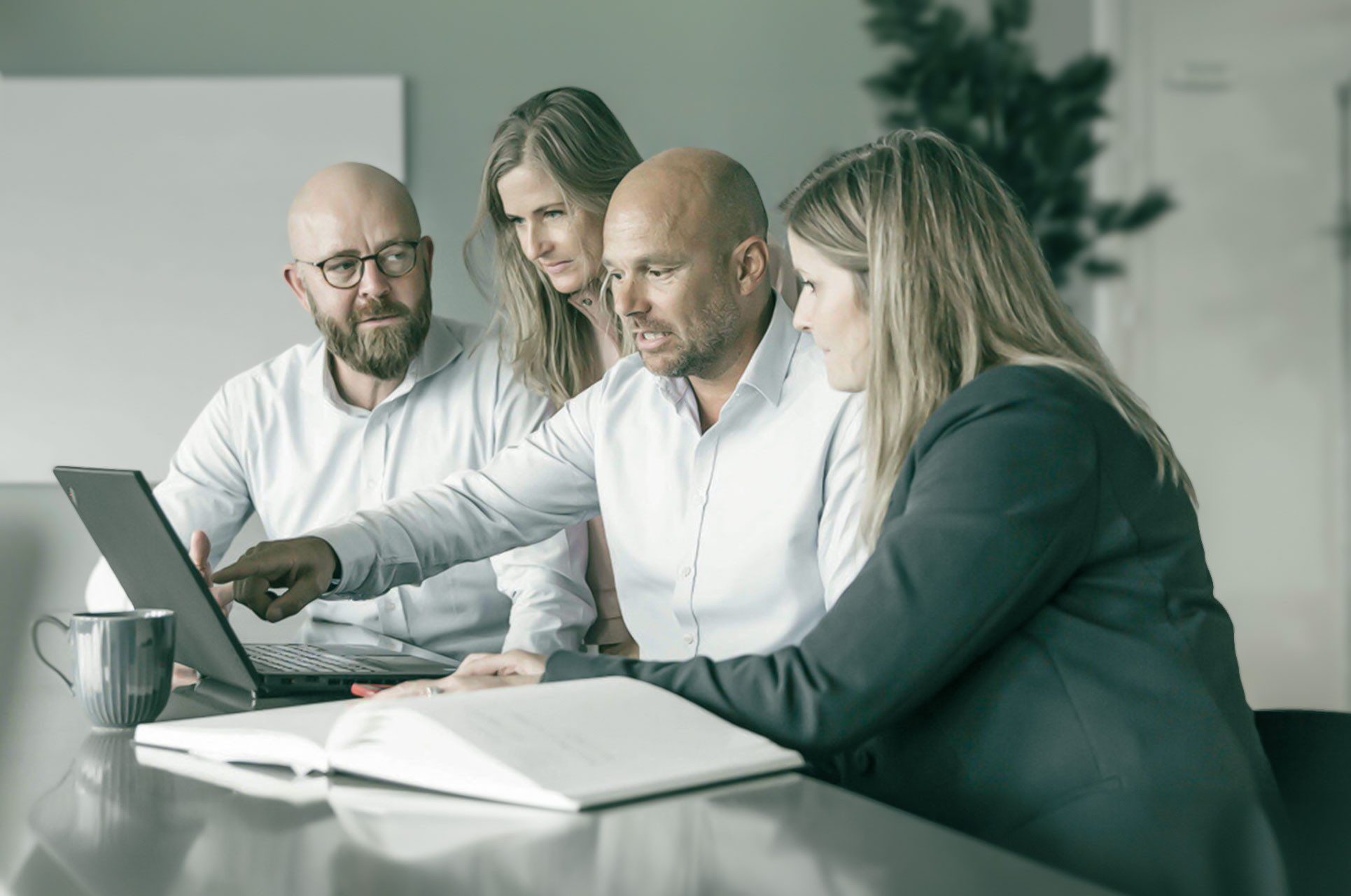 Professionals looking at sales at meeting