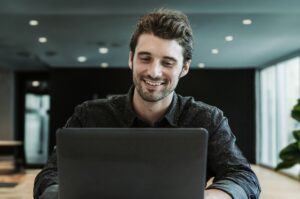 Young man in online meeting receiving feedback and coaching