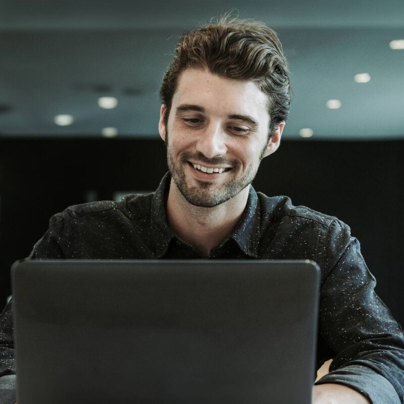 Young man in online meeting receiving feedback and coaching